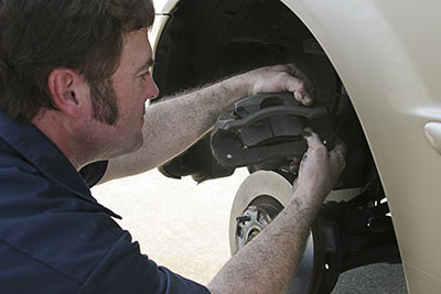 Chicago mobile brake mechanic performing a mobile brake repair at home